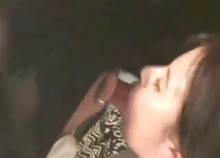 Hot-looking brunette sucks a dog cock hard