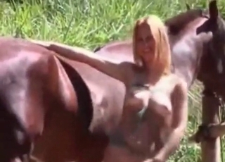 Incredible blonde slut really loves having sex with a brown stallion