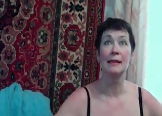 Mature woman is filed fucking her cute pet