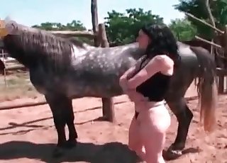 Dirty black-haired slut fucks with a colt