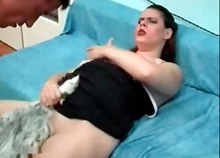 Dog fucker holds her horny pet